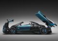 A 1-of-1 Pagani Unico Blue Carbon Zonda Roadster sports car with its front trunk, doors, and rear engine cover all open, displayed against a dark gradient background.