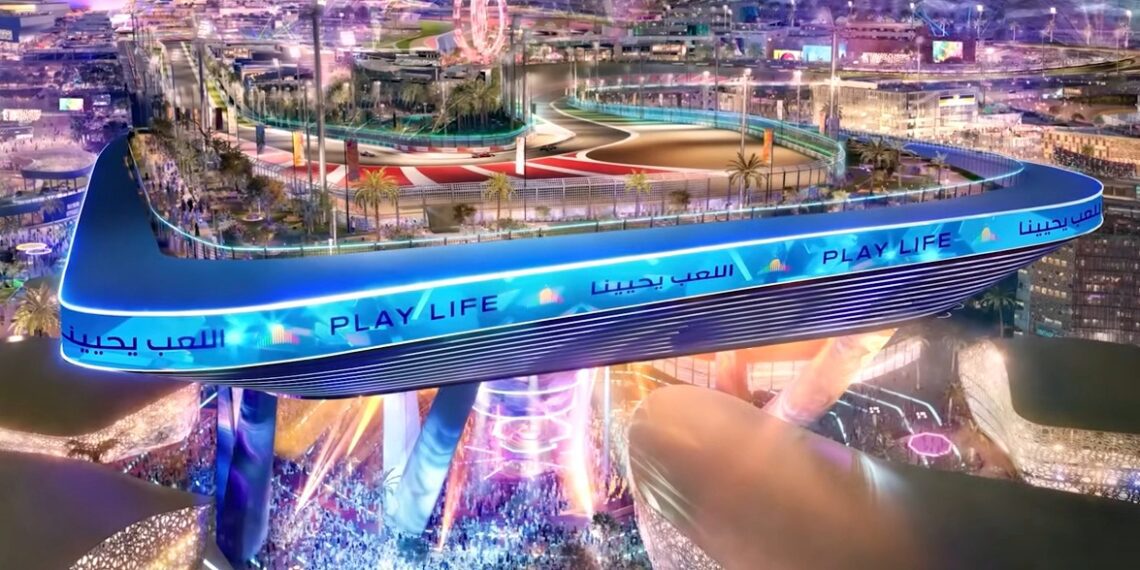 A large elevated race track labeled "PLAY LIFE" overlooks a brightly lit cityscape, with crowds gathered below and colorful lights illuminating the area—this upcoming F1 track’s opening corner is 20 storeys up in the sky.