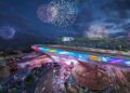 A futuristic cityscape at night with colorful fireworks in the sky, illuminated buildings, and a vibrant elevated structure—this upcoming F1 track’s opening corner is 20 storeys up in the sky, showcased on dazzling digital displays.