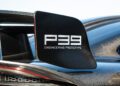 Close-up of a carbon fiber rear wing endplate on a car, labeled "P39 ENGINEERING PROTOTYPE," with part of the taillight and body visible.
