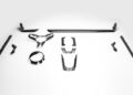 Several black carbon fiber automotive interior trim pieces, designed as TECHART performance upgrades for the 992.2 Carrera, are arranged neatly on a plain white background.