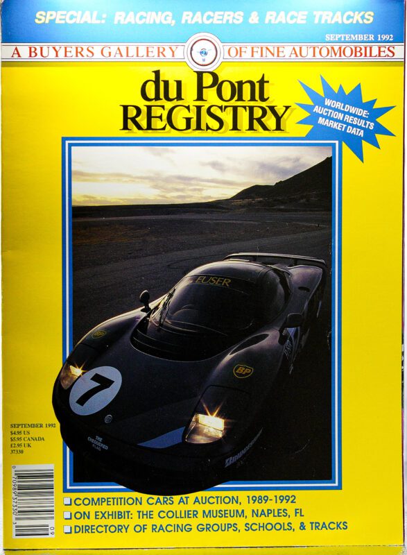 DuPont REGISTRY’s September 1992 Cover Cars issue showcases a black vintage race car cruising a coastal road, spotlighting auction and racing content in celebration of the magazine’s 40th Anniversary.