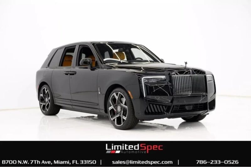 Sleek black luxury SUV with tinted windows and custom wheels displayed in a white studio setting; this luxury car is available—dealership contact information shown at the bottom.