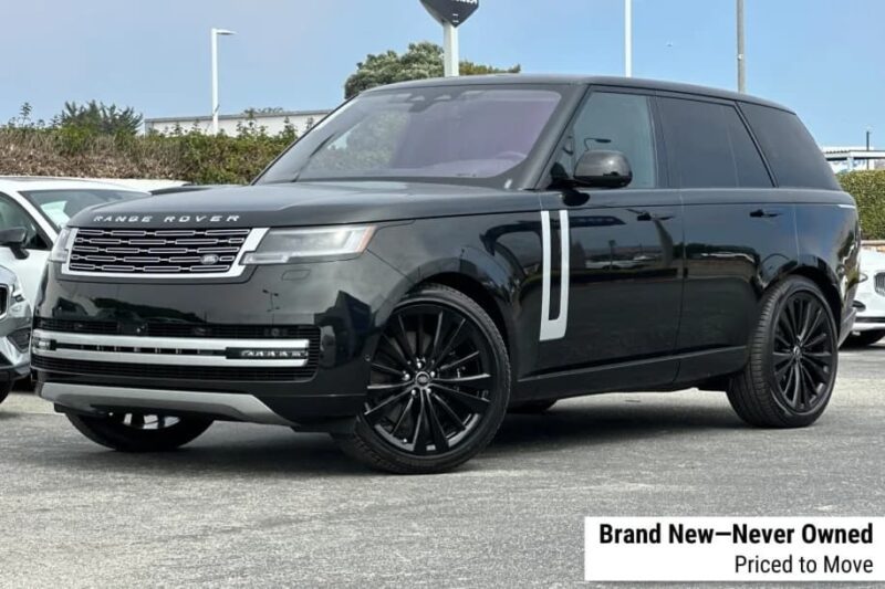 Black Range Rover SUV parked in a lot on a sunny day; text overlay reads "Brand New—Never Owned, Priced to Move." Discover more exclusive Rovers and Range Rover SV Carmel Edition models now available.