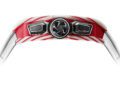 Close-up view of a Richard Mille RM 72-01 Chronograph watch case with a red and white striped pattern and a central black and silver emblem, inspired by Charles Leclerc, isolated on a white background.