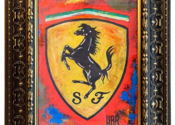 Framed painting of the Ferrari logo featuring a black prancing horse on a yellow shield with “SF” initials, set against a vibrant red, blue, and yellow background—perfect for display at the Saratoga Motorcar Auction or Fine Art Auction.