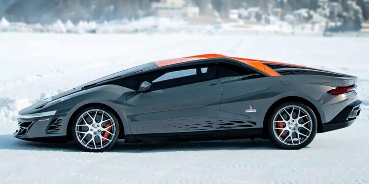 A sleek, gray sports car with orange accents, inspired by The Last Wedge: Centennial 1-of-1 Bertone Nuccio Is Headed To Auction, is parked on a snowy surface with a blurred winter landscape in the background.