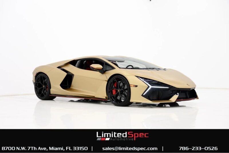A gold Lamborghini Revuelto exotic car with a powerful V12 engine is displayed in a white studio setting, with dealership contact information shown at the bottom.