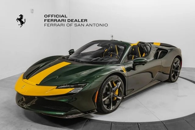 A green Ferrari sports car with yellow racing stripes is displayed in a showroom labeled "Ferrari of San Antonio," showcasing unique Ferrari colors under official Ferrari branding.
