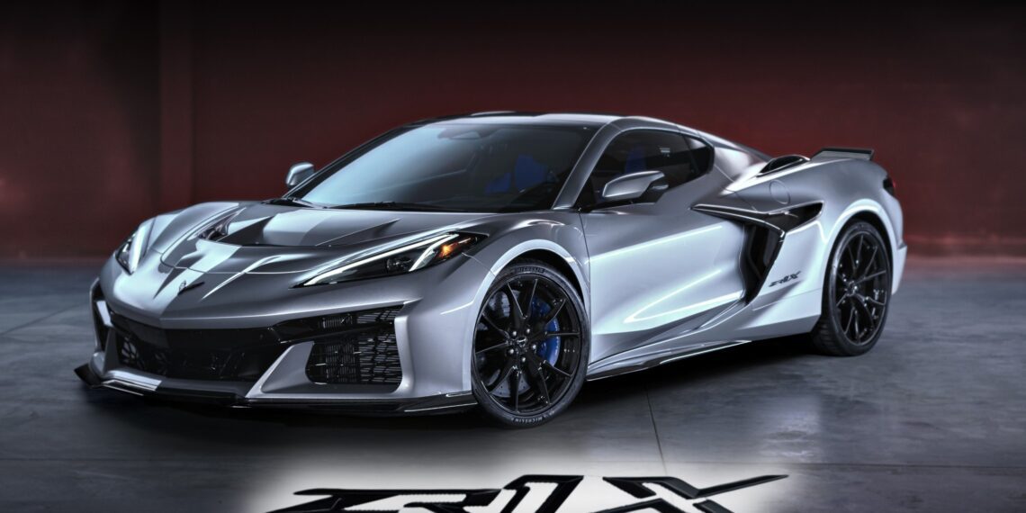 A silver Chevrolet Corvette ZR1 sports car is parked indoors, its model name "ZR1X" illuminated on the floor in front. Revealed: 2026 Corvette ZR1X is the most powerful Chevrolet ever built.