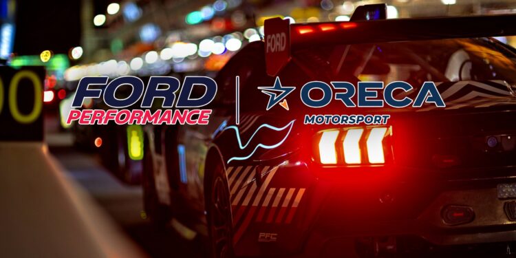 A race car with illuminated taillights is parked in a pit lane at night. The logos "Ford Performance" and "ORECA Motorsport" stand out, hinting at excitement for Ford returning to Le Mans and the anticipation of Ford Le Mans 2027.