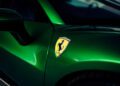 Close-up of a green Ferrari 296 GTS, showing the side mirror and the Ferrari logo on the front fender—a modern tribute to Italian design.