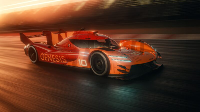 An orange Genesis Hypercar with the number 10 speeds down a racetrack at sunset, capturing the thrilling spirit of Le Mans.
