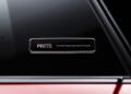 Close-up of a metallic badge on a car window that reads "PECTO Porsche Experience Centre Toronto," highlighting the exclusive experience at the Porsche Experience Center.