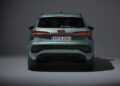 Rear view of the 2026 Audi Q3 Breaks Cover: Here's What's New—light green SUV with illuminated LED tail lights, Audi badge, and a German license plate reading "IN Q 3360" against a neutral background.