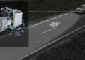 A car, like the 2026 Audi Q3 Breaks Cover: Here's What's New, projects a snowflake symbol onto the road using a headlamp system to highlight hazardous winter conditions; a close-up of the projection mechanism is shown.
