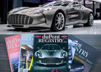 A silver Aston Martin One-77 sports car is displayed above, while below are issues of duPont Registry magazine featuring the same car on the cover—highlighting The Incredible Story Of The '78th' Aston Martin One-77.