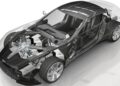 A partially transparent sports car revealing its interior, engine, and mechanical components with the driver's side door open—echoing The Incredible Story Of The '78th' Aston Martin One-77.