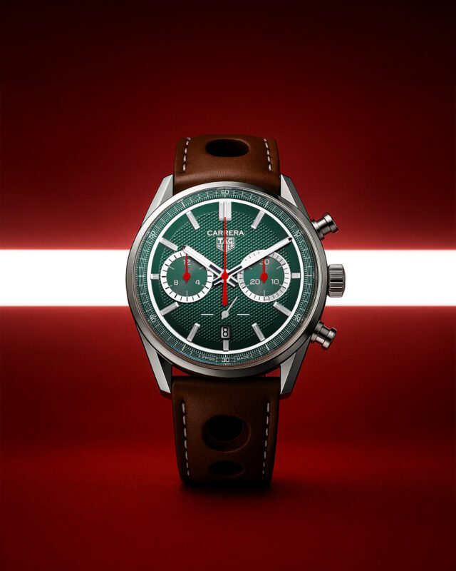 A TAG Heuer Carrera watch with a green textured dial, brown leather strap, and silver case is displayed upright against a red background with a white horizontal light strip, celebrating TAG Heuer as the Official Timing Partner of the Goodwood Festival of Speed.