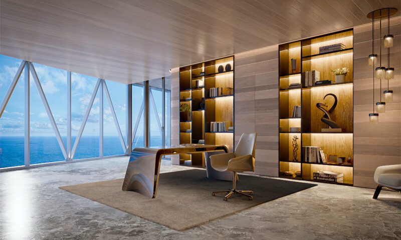 Modern penthouse office with large glass windows overlooking the ocean at Bentley Residences Miami. Features a sleek desk, white chairs, built-in illuminated bookshelves, pendant lights, and marble flooring. Listed at $37.5M.