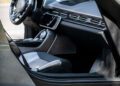 Car door open revealing the sleek interior and dashboard of the Peralta S supercar, with steering wheel, display screen, and "PERALTA S" label visible on the door sill—echoing luxury fit for the Monterey Motorsports Festival.