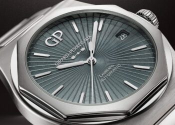 Close-up of a Girard-Perregaux Laureato 50th Anniversary watch featuring a textured blue dial, silver hands and indices, date display at 3 o'clock, and a sleek stainless steel case.
