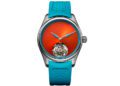 Discover the H.Moser Pioneer Spiced Aqua, a wristwatch with a bright orange dial, visible tourbillon at 6 o'clock, blue hands, and a blue perforated rubber strap—an eye-catching piece from the new collection.