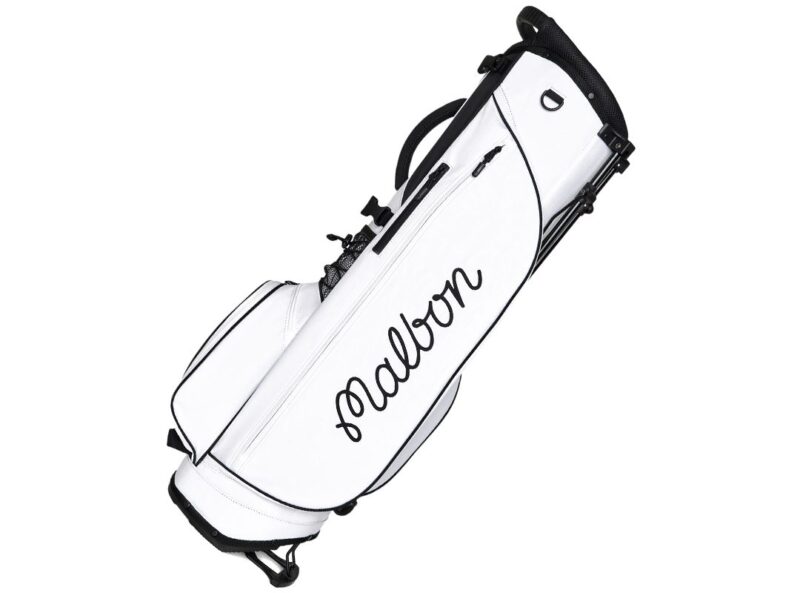 White golf bag with black accents, featuring the word "Malbon" in cursive lettering on the side—a stylish pick for any golfer and a top choice in the duPont REGISTRY Father's Day Gift Guide.