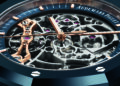 Close-up of an Audemars Piguet watch face showcasing horological highlights—visible intricate gears, rose gold details, and a blue outer ring with screws—making it a standout among the most expensive watches.