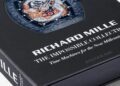 A close-up of the Assouline coffee table book titled "Richard Mille: The Impossible Collection," featuring a watch with an intricate dragon design on the cover.