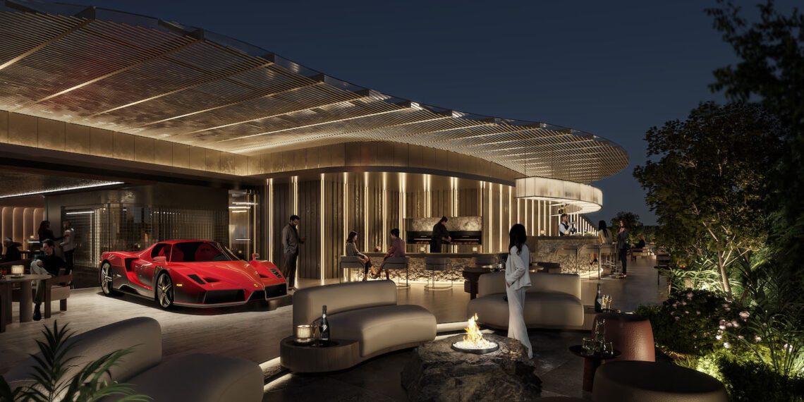 Outdoor luxury lounge at night with modern seating, a central fire pit, and a red sports car from the duPont REGISTRY Group parked as guests socialize near PRIVÉ Sofia’s contemporary building illuminated with warm lighting.