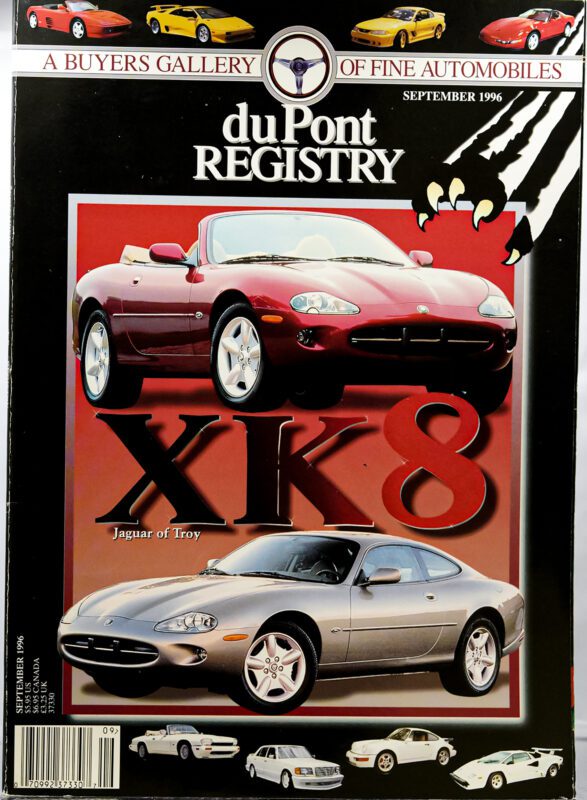 Cover Cars: September 1996 duPont REGISTRY magazine featuring red and silver Jaguar XK8s, "Jaguar of Troy" headline, and classic cars at the bottom, celebrates Jaguar’s 40th Anniversary.
