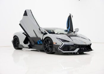 A silver 2025 Mansory Lamborghini Revuelto with scissor doors open, shown in a white studio setting. This Limited Spec supercar is set to stun enthusiasts across the U.S.