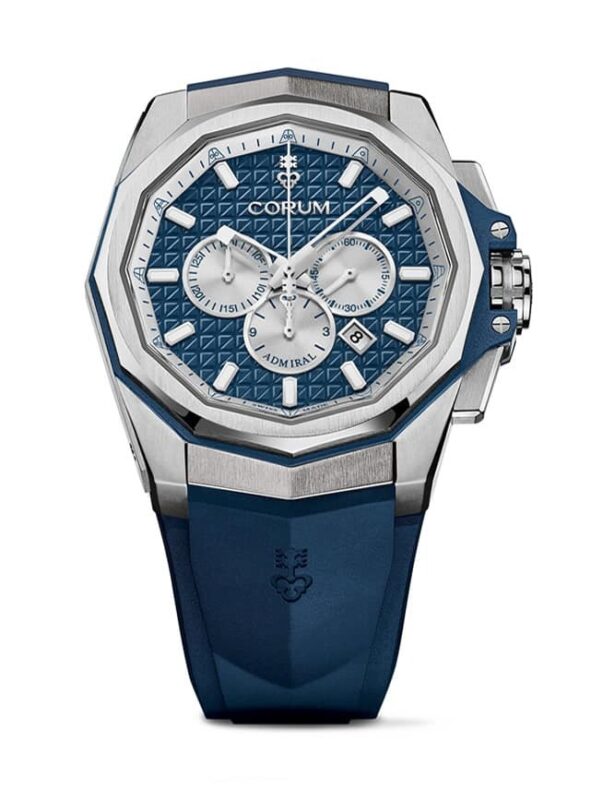 A silver and blue Corum Admiral wristwatch with a geometric-patterned dial, three subdials, and a blue rubber strap—a standout among the best luxury watches for modern style and elegance.