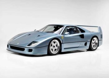 Azzurro Hyperion Ferrari F40 sports car photographed in a studio setting with a plain white background, showcased for RM Sotheby's.