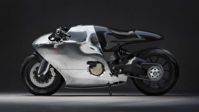A sleek, futuristic motorcycle with a polished metallic body, exposed rear wheel, and minimalist design stands as rideable art—a limited edition masterpiece—positioned on a dark background.