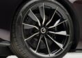 Close-up of a black car wheel with a multi-spoke alloy rim, Pirelli tire, and visible brake disc—just like the stunning ultra-low mile McLaren Speedtail with $250k in MSO options heading to auction.
