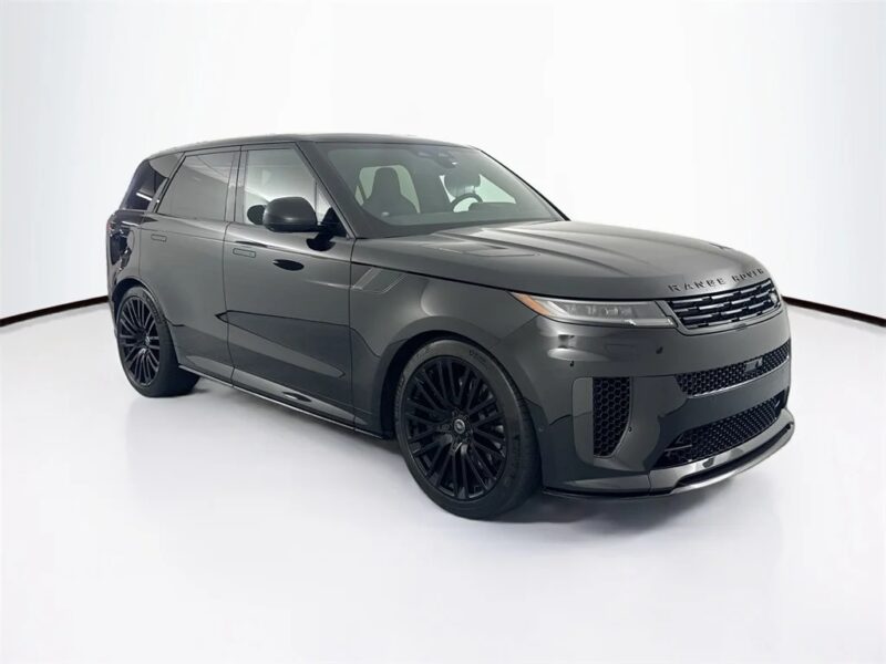 A black Range Rover SUV, one of the best Range Rovers in its class, is parked in a well-lit studio with a white background, viewed from the front-left angle.