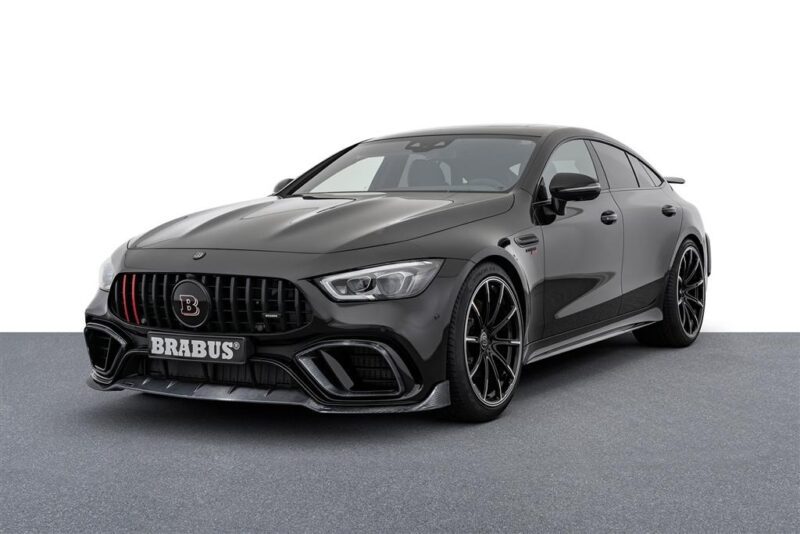 A black Brabus-tuned Mercedes-Benz sedan, a unique creation, is parked on a gray surface with a white background—perfect for those seeking custom cars for sale to elevate their garage.