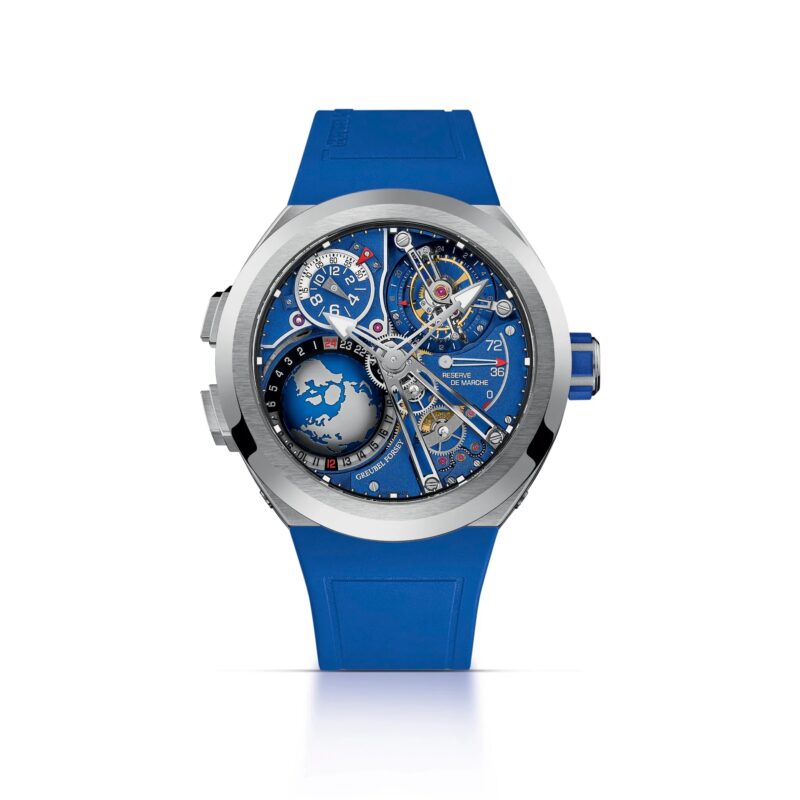 A luxury wristwatch with a blue strap and detailed, exposed mechanical components on a blue dial, featuring multiple dials and a world map design—an exceptional piece among the best luxury watches.