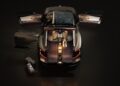 Overhead view of a Bentley EV Concept with all four doors and trunk open, revealing a spacious interior with tan seats and two duffel bags placed outside the vehicle.