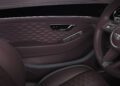 Close-up of a Bentley luxury car interior, showcasing purple leather seats, Mulliner Interior patterned door panel, chrome accents, and the iconic Bentley logo on the steering wheel.