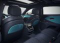 View of a Bentley luxury car interior featuring blue and black leather seats, a rear-seat entertainment screen, and a panoramic sunroof—showcasing bespoke Mulliner interior options.