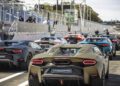 Several Lamborghini supercars, including the dynamic debut of the Lamborghini Temerario, are parked in a row on track, with spectators and officials visible behind barriers.