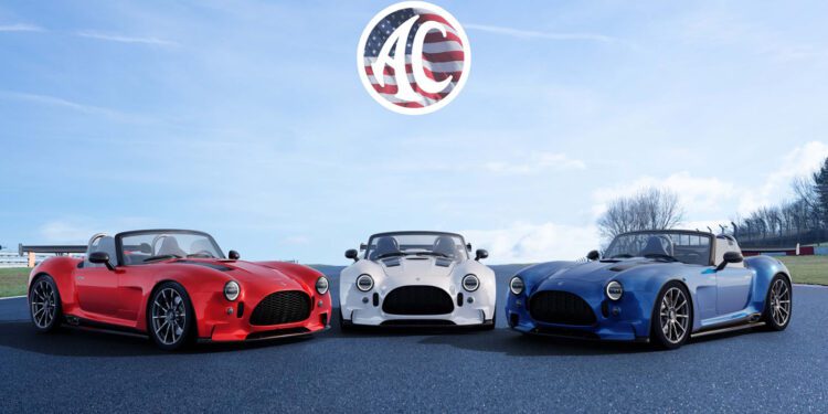 Three sports cars—red, white, and blue—are parked on asphalt under a blue sky with a logo featuring the letters "AC" and an American flag design above them.