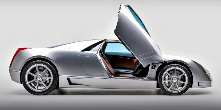 A silver sports car with gull-wing doors open, shown in a side profile against a neutral background—reminiscent of the 10 unsung mid-engine American concepts that pushed the envelope of performance.