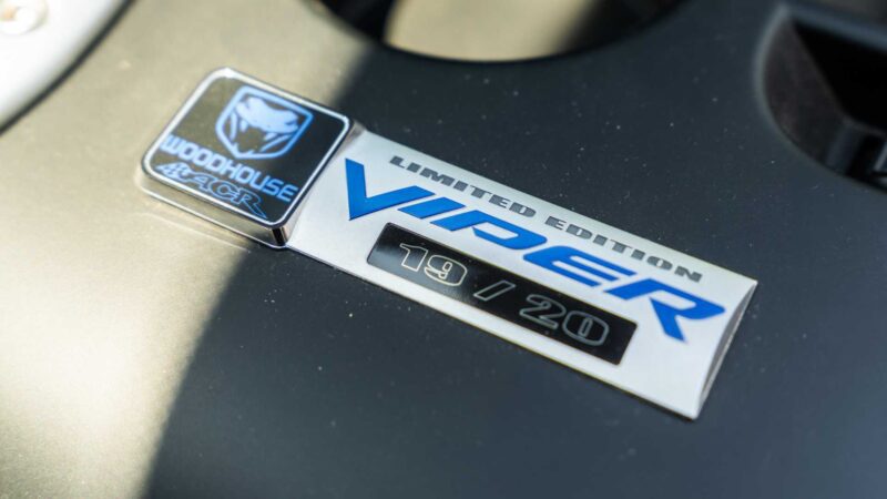 Close-up of a metal badge reading "WOODHOUSE ACR LIMITED EDITION VIPER 19/20" on a vehicle surface—Bid On This 2010 Dodge Viper SRT-10 Roadster ACR With Just 20 Miles.