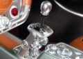 Close-up of a Pagani car interior featuring a metal gated manual gear shifter, brown leather seats, and a detailed control panel—perfect for the thrill of a hillclimb or debut at Goodwood FoS 2025.