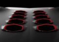 Close-up of the only street-legal Lamborghini Sesto Elemento's hood, featuring two rows of five hexagonal air vents outlined in red, set against a dark, textured surface—an unforgettable sight that wowed Goodwood.