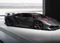 A matte black Lamborghini Sesto Elemento, famed as the only street-legal model, is parked indoors next to a large window, sunlight partially illuminating its sleek lines—a showstopper worthy of Goodwood.